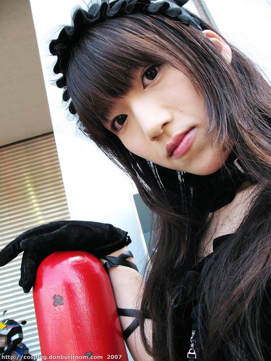 suzuyuki kaho, morte (vispo), vispo original, highres, photo (medium), tagme, 1girl, 2007, apron, arm laces, asian, bare shoulders, black dress, black gloves, collar, cosplay, dress, dutch angle, female focus, gloves, gothic lolita, hairband, japanese (nationality), lolita fashion, lolita hairband, looking at viewer, maid, maid apron, outdoors, solo, watermark, web address