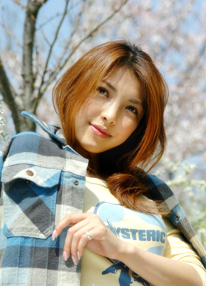 souma akane, looking away, photo (medium), tagme, 1girl, asian, blurry, cherry blossoms, depth of field, dyed hair, female focus, flannel, flannel shirt, french nails, from below, japanese (nationality), jewelry, long hair, looking at viewer, outdoors, ring, smile, solo, tree, upper body