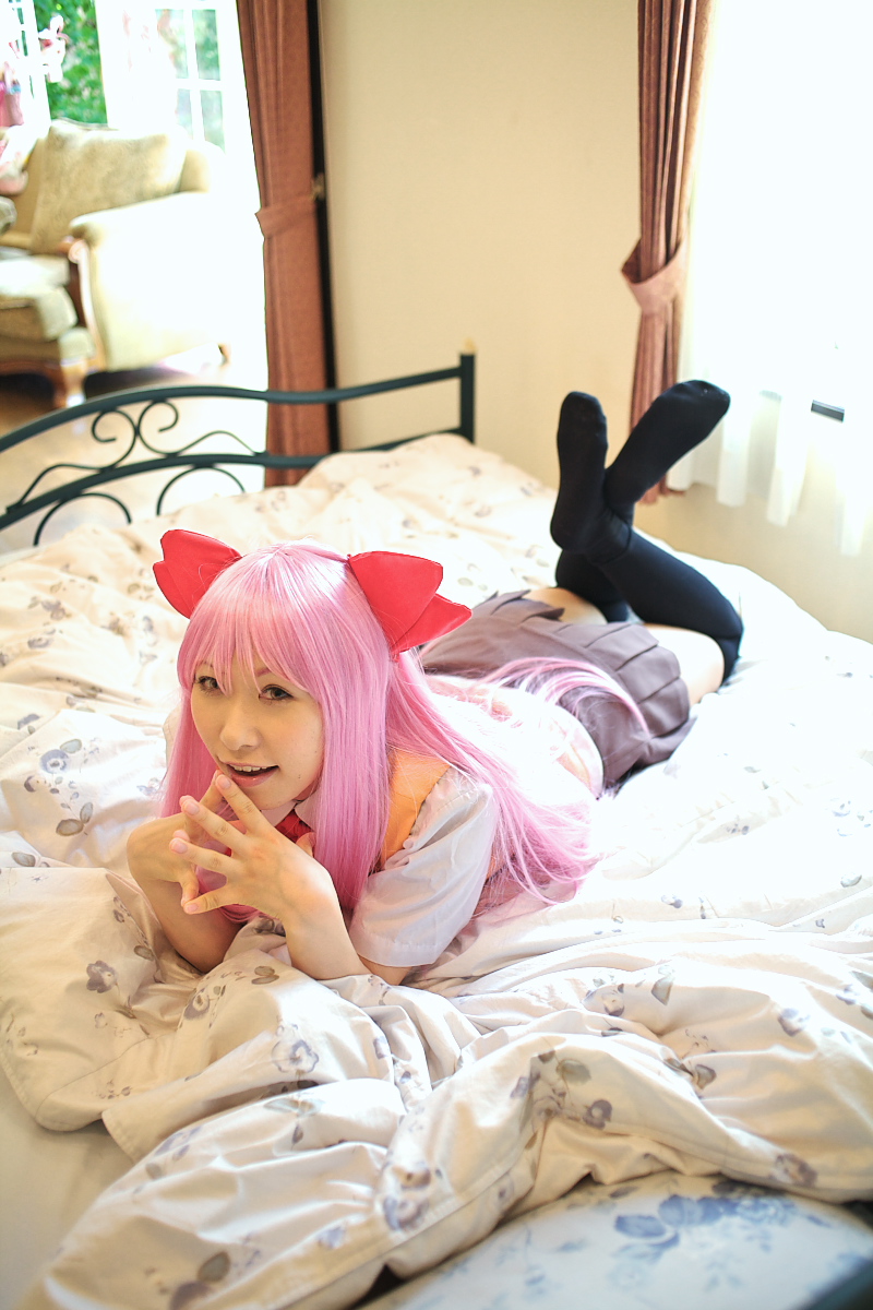 chippi, munakata shiho, my-hime, highres, photo (medium), 1girl, asian, bed, bedroom, black thighhighs, color contacts, cosplay, feet, female focus, indoors, long hair, looking at viewer, lying, munakata shiho (cosplay), on stomach, pink hair, school uniform, solo, thighhighs