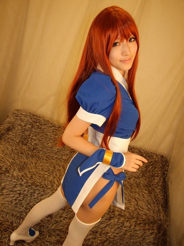 saya (cosplayer), kasumi (doa), dead or alive, tecmo, white legwear, photo (medium), 1girl, asian, cosplay, curtains, dutch angle, female focus, indoors, kasumi (doa) (cosplay), long hair, looking at viewer, looking back, ninja, pelvic curtain, red hair, shoes, smile, solo, white shoes