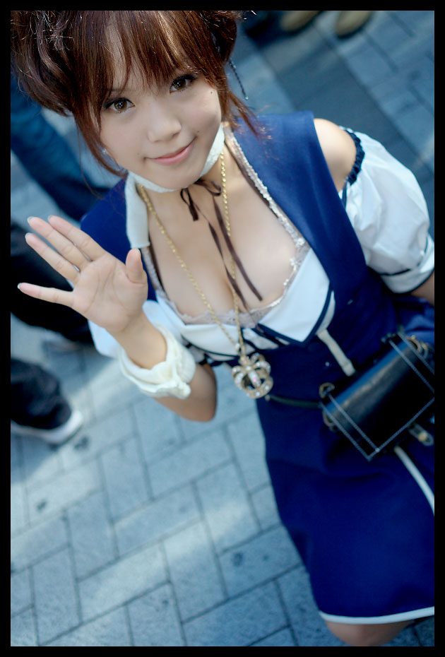 kipi-san, acasius boarding school, photo (medium), 1girl, asian, breasts, brown eyes, brown hair, cleavage, cosplay, dutch angle, female focus, looking at viewer, mole, outdoors, school uniform, short hair, small breasts, solo