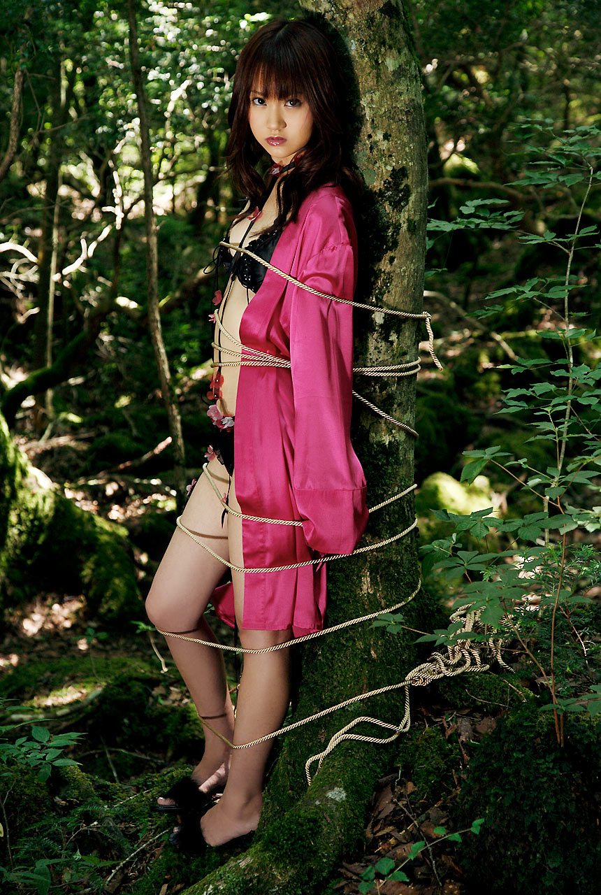 hamada shoko, highres, photo (medium), 1girl, asian, bdsm, bondage, bound, bra, brown hair, female focus, forest, lace, lingerie, long hair, looking at viewer, nature, open clothes, open robe, outdoors, panties, robe, solo, tree, underwear