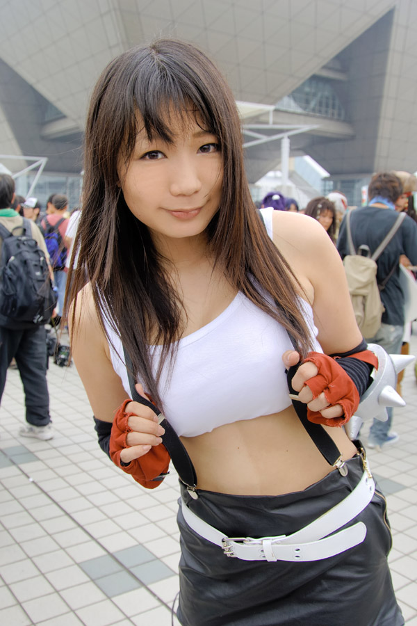 chocoball, tifa lockhart, final fantasy, final fantasy vii, photo (medium), 1girl, asian, belt, cosplay, fingerless gloves, gloves, miniskirt, outdoors, skirt, solo focus, standing, suspenders, tank top