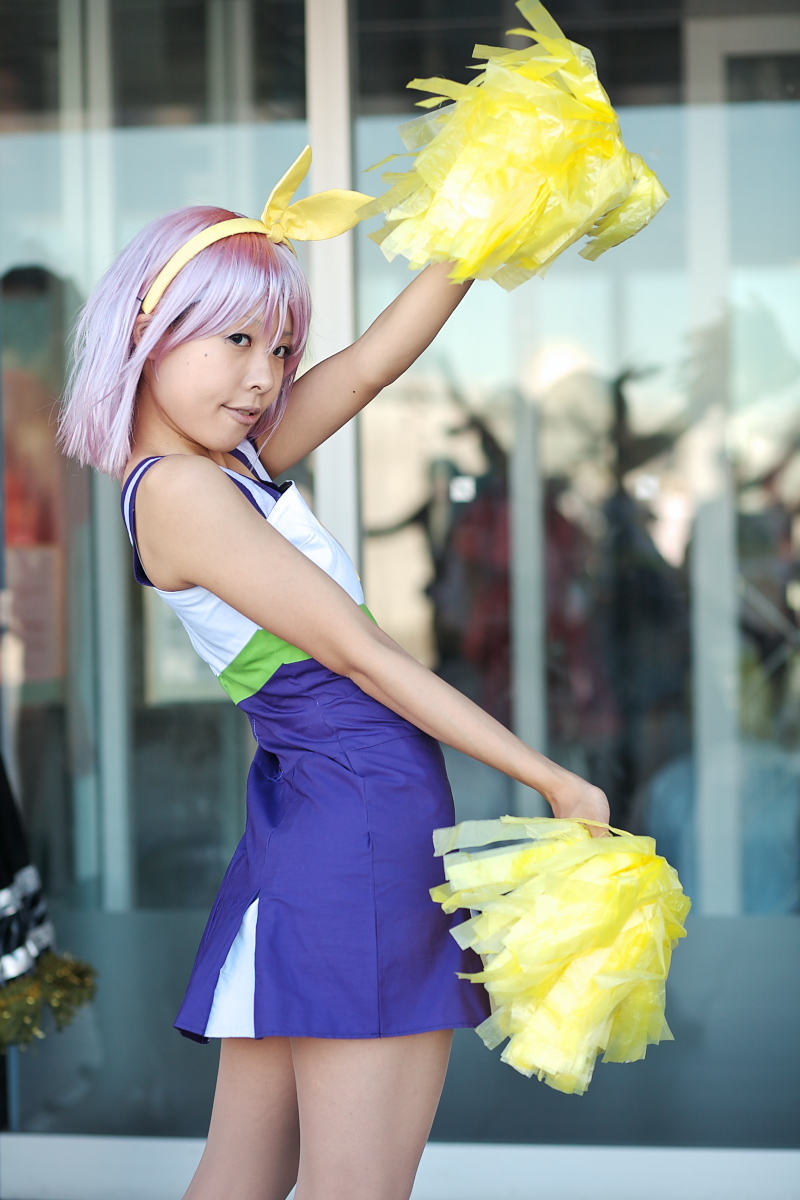 hiiragi tsukasa, lucky star, highres, photo (medium), bow, cheerleader, cosplay, hair bow, maritsuki haru, pom pom (cheerleading), purple hair