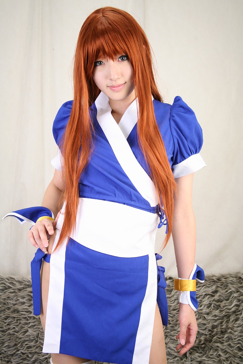 saya (cosplayer), kasumi (doa), dead or alive, tecmo, highres, photo (medium), 1girl, asian, cosplay, couch, curtains, female focus, indoors, kasumi (doa) (cosplay), long hair, looking at viewer, ninja, pelvic curtain, red hair, solo, thighhighs, white thighhighs