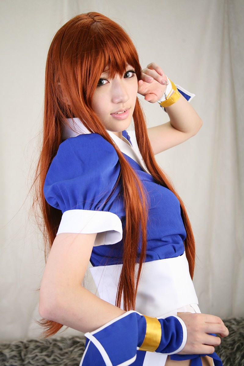 saya (cosplayer), kasumi (doa), dead or alive, tecmo, white legwear, highres, photo (medium), 1girl, asian, cosplay, couch, curtains, female focus, indoors, kasumi (doa) (cosplay), long hair, looking at viewer, ninja, pelvic curtain, red hair, solo