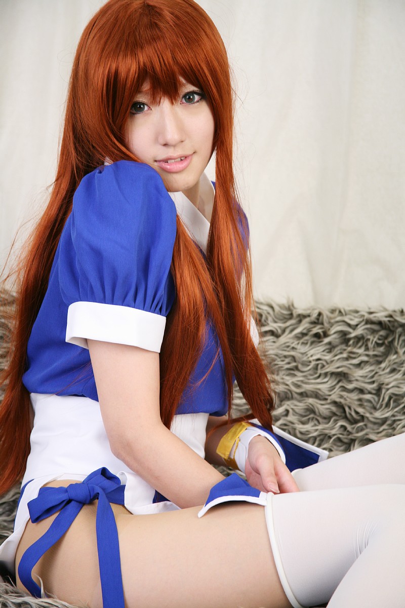 saya (cosplayer), kasumi (doa), dead or alive, tecmo, highres, photo (medium), 1girl, asian, cosplay, couch, curtains, female focus, indoors, kasumi (doa) (cosplay), long hair, looking at viewer, ninja, pelvic curtain, red hair, solo, thighhighs, white thighhighs
