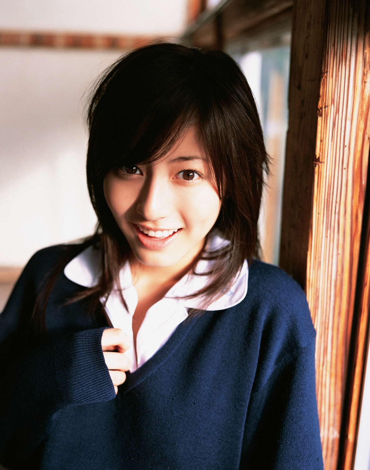 sugimoto yumi, highres, photo (medium), 1girl, asian, brown hair, classroom, cosplay, female focus, indoors, long hair, looking at viewer, miniskirt, open mouth, pleated skirt, school, school uniform, skirt, solo, sweater