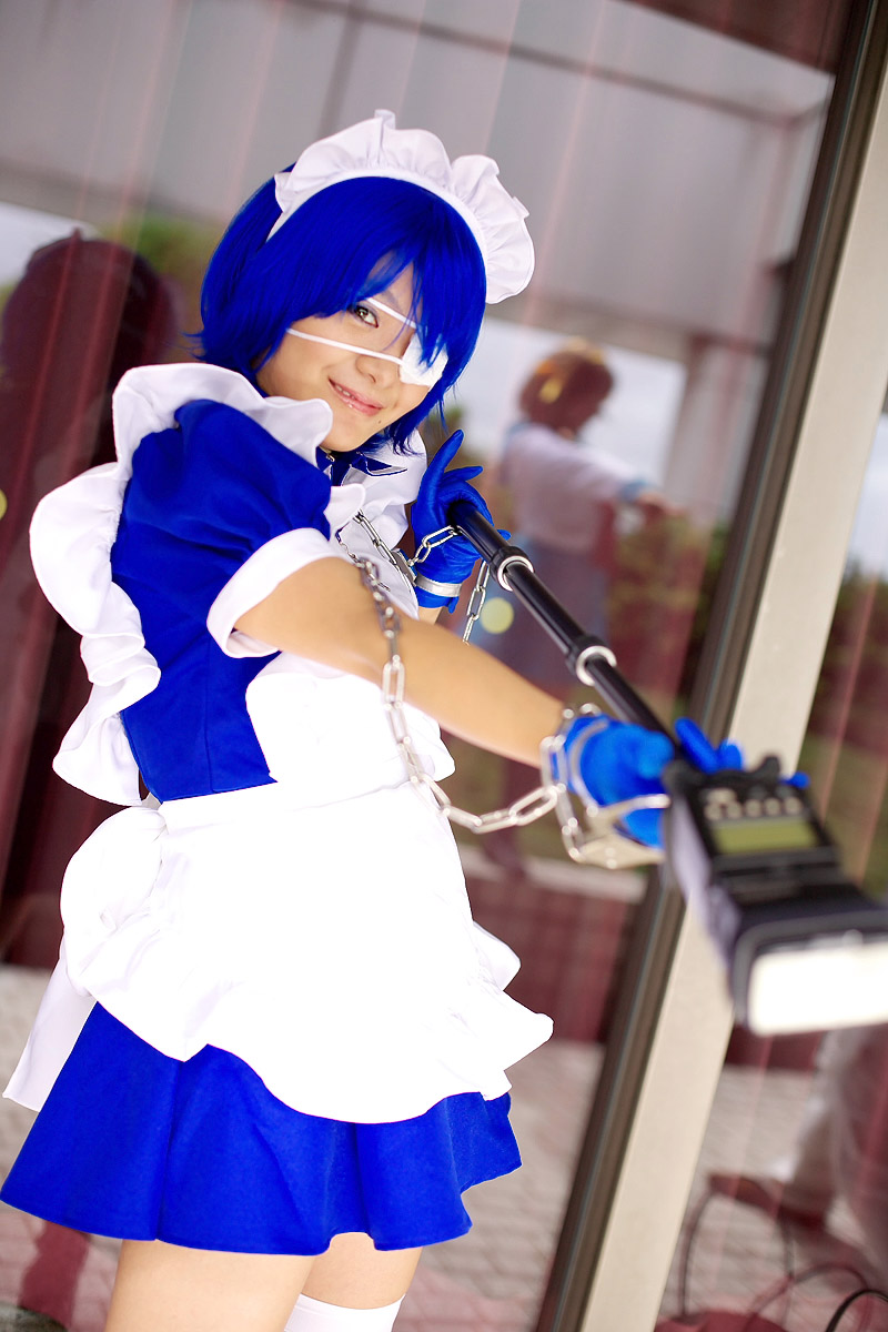 riori, ryomou shimei, ikkitousen, highres, photo (medium), apron, cosplay, cuffs, eyepatch, gloves, handcuffs, maid, maid apron, ryomou shimei (cosplay), thighhighs