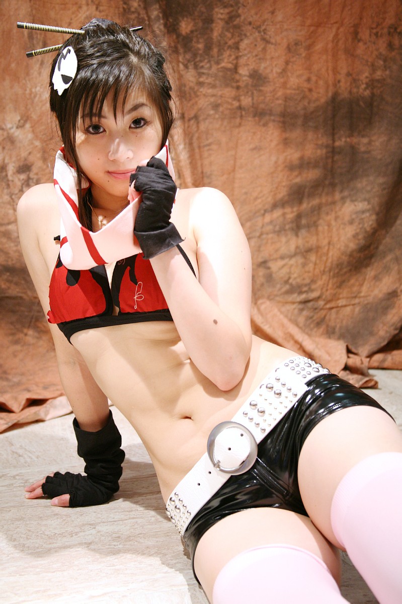 saito (model), yoko littner, tengen toppa gurren lagann, highres, photo (medium), bikini, bikini top only, chopsticks, cosplay, fingerless gloves, gloves, red hair, shorts, swimsuit, thighhighs