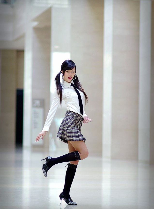 hwang mi hee, photo (medium), tagme, 1girl, black hair, black socks, breasts, earrings, female focus, fingernails, full body, high heels, hoop earrings, jewelry, lips, long fingernails, long hair, long sleeves, necktie, open mouth, pleated skirt, shoes, skirt, socks, solo, teeth, twintails