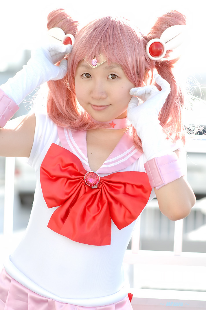 miasa, chibi usa, sailor chibi moon, bishoujo senshi sailor moon, photo (medium), 1girl, asian, brown eyes, contrapposto, cosplay, female focus, gloves, looking at viewer, mole, mole under eye, outdoors, pink hair, sailor, sailor chibi moon (cosplay), school uniform, serafuku, solo, standing, twintails, white gloves