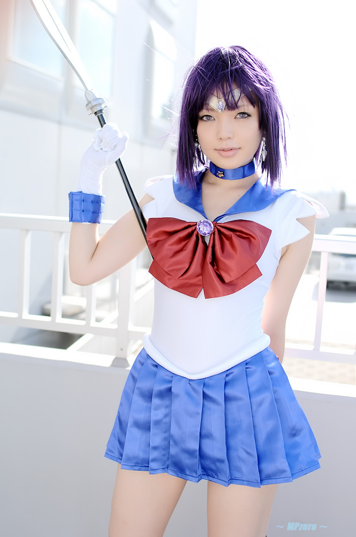 namada, sailor saturn, tomoe hotaru, bishoujo senshi sailor moon, photo (medium), 1girl, asian, blue choker, blue skirt, bow, breasts, brooch, building, choker, circlet, color contacts, contrapposto, cosplay, cowboy shot, female focus, gloves, jewelry, looking at viewer, magical girl, miniskirt, outdoors, pantyhose, parted lips, pleated skirt, polearm, purple hair, railing, red bow, ribbon, sailor saturn (cosplay), sailor senshi uniform, school uniform, serafuku, shirt, short hair, skirt, sleeveless, small breasts, solo, standing, weapon, white gloves, white shirt