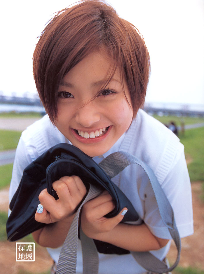 ueto aya, bookbag, photo (medium), 1girl, asian, bag, blouse, cosplay, female focus, japanese (nationality), outdoors, school uniform, serafuku, shirt, solo, squatting, sweater vest