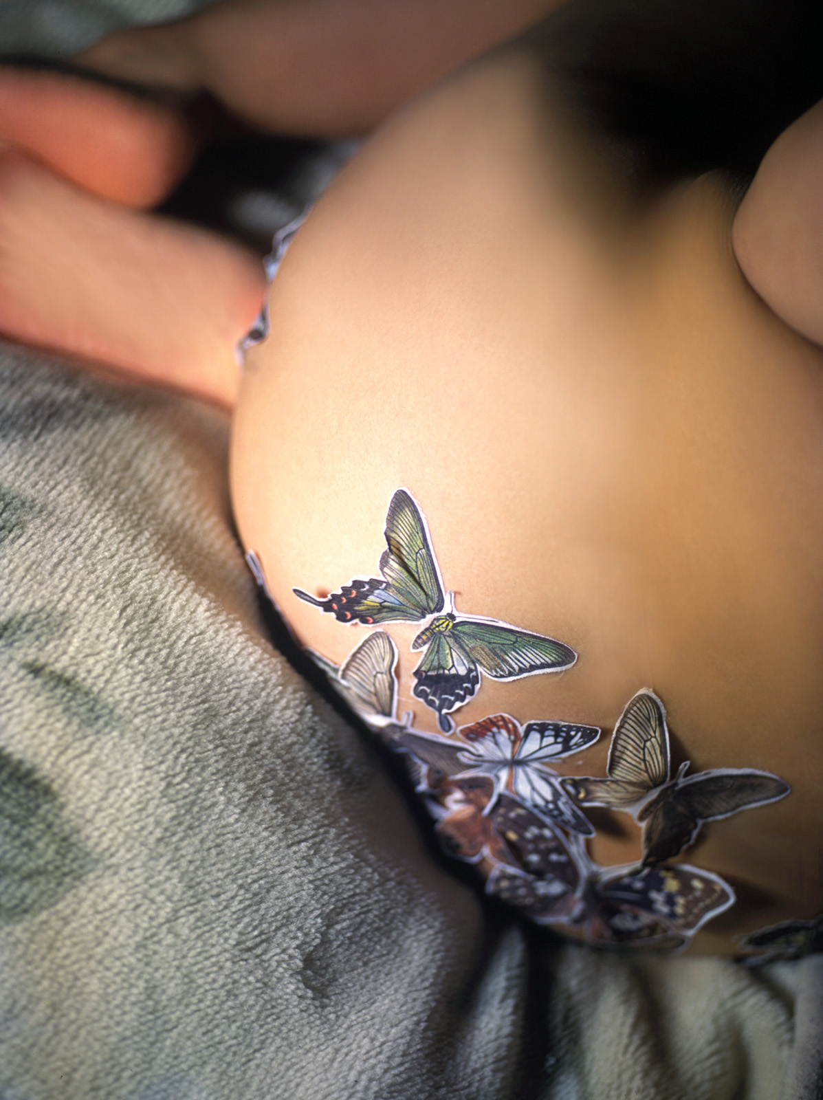 hanai miri, highres, photo (medium), 1girl, asian, ass, bed, black hair, breasts, bug, butterfly, female focus, indoors, insect, large breasts, long hair, ns eyes 337, nude, solo, sticker