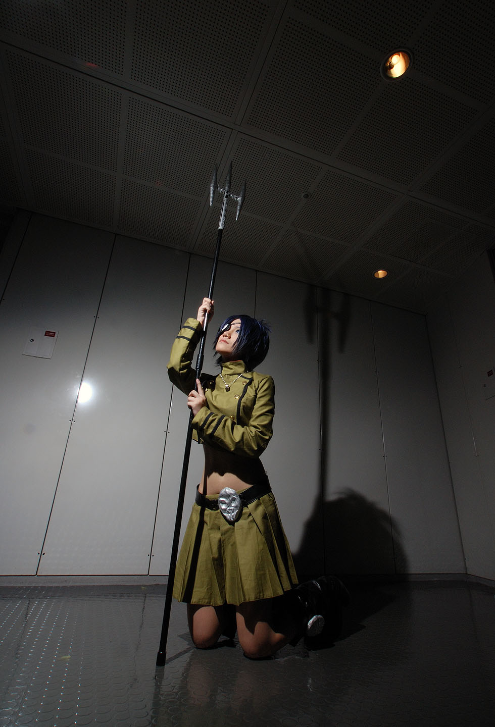 isumi (i-spixi), chrome dokuro, kateikyoushi hitman reborn, katekyo hitman reborn!, highres, photo (medium), 1girl, blue hair, boots, cosplay, eyepatch, female focus, full body, indoors, jewelry, midriff, necklace, pleated skirt, polearm, skirt, solo, spear, trident, weapon