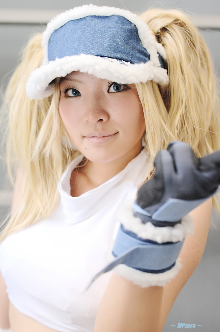 nogu, blue mary, kof: maximum impact, snk, the king of fighters, photo (medium), 1girl, blonde hair, blue eyes, chaps, cosplay, female focus, gloves, halterneck, long hair, midriff, solo, twintails