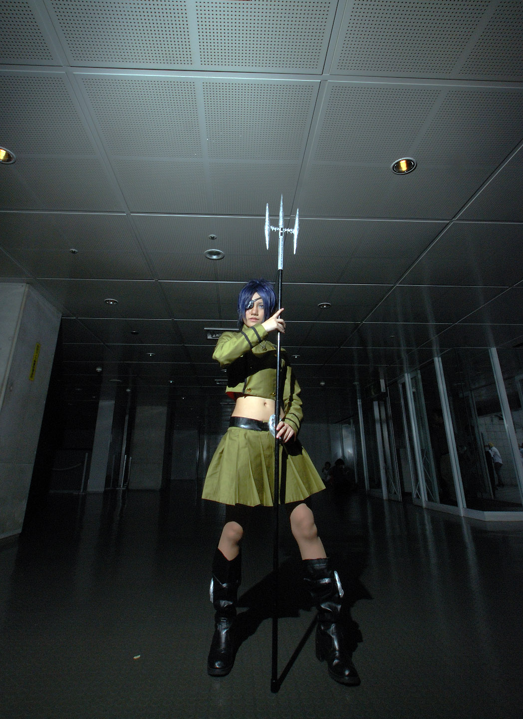 isumi (i-spixi), chrome dokuro, katekyo hitman reborn!, highres, photo (medium), 1girl, blue hair, boots, cosplay, eyepatch, female focus, full body, indoors, midriff, pleated skirt, polearm, skirt, solo, spear, trident, weapon