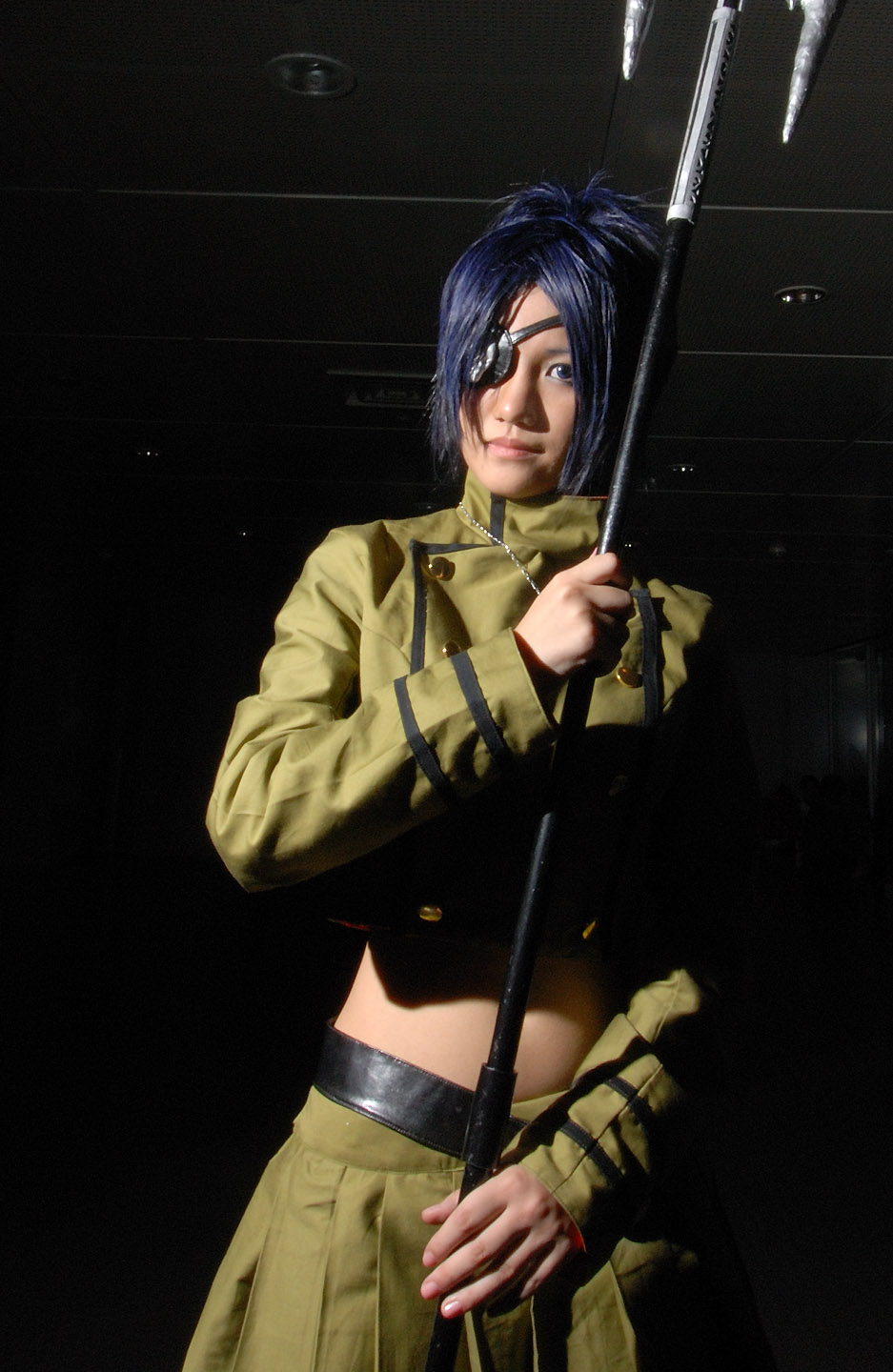 isumi (i-spixi), chrome dokuro, katekyo hitman reborn!, highres, photo (medium), 1girl, blue hair, cosplay, eyepatch, female focus, indoors, midriff, pleated skirt, polearm, skirt, solo, spear, trident, weapon