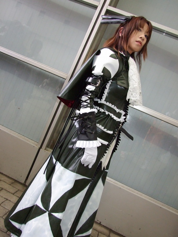 torai aki, sega, shining (series), shining wind, photo (medium), 1girl, asian, brown hair, coat, cosplay, dutch angle, female focus, gloves, long hair, looking at viewer, overcoat, scarf, solo, white gloves, xecty ein (cosplay)