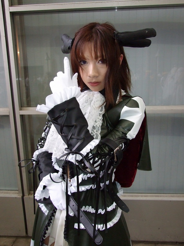 torai aki, sega, shining (series), shining wind, photo (medium), 1girl, asian, brown hair, coat, cosplay, dutch angle, female focus, gloves, long hair, looking at viewer, overcoat, scarf, solo, thighhighs, white gloves, xecty ein (cosplay)