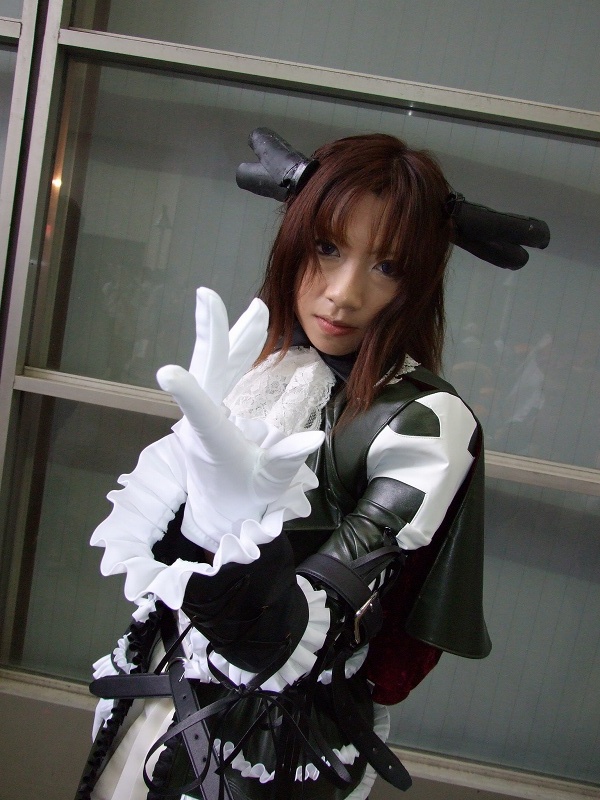 torai aki, sega, shining (series), shining wind, photo (medium), 1girl, asian, brown hair, coat, cosplay, dutch angle, female focus, gloves, long hair, looking at viewer, overcoat, scarf, solo, white gloves, xecty ein (cosplay)