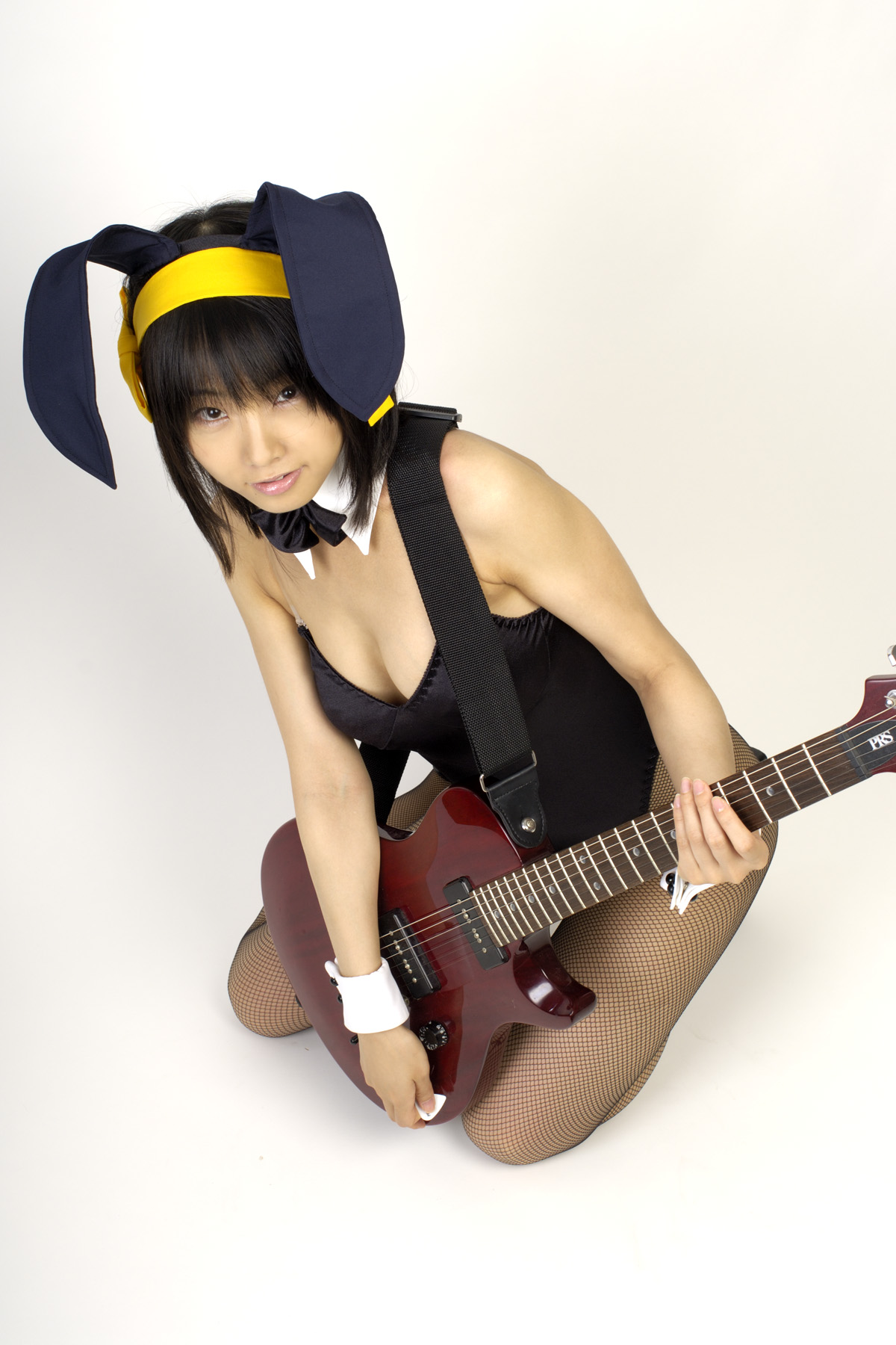 matsunaga ayaka, suzumiya haruhi, suzumiya haruhi no yuuutsu, fishnet legwear, highres, photo (medium), animal ears, asian, bow, bowtie, breasts, cleavage, cosplay, costume, fake animal ears, fishnets, guitar, hair ribbon, instrument, leotard, playboy bunny, rabbit ears, ribbon, thighhighs