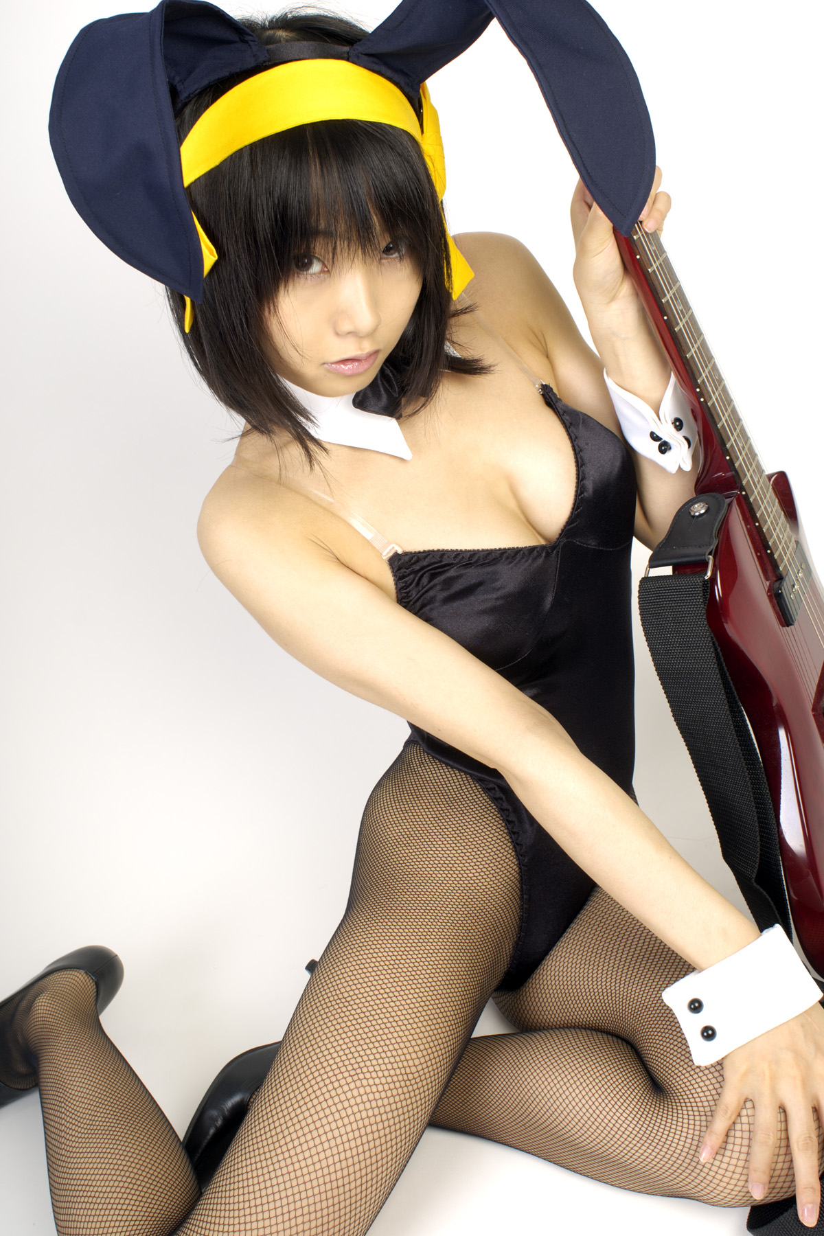 matsunaga ayaka, suzumiya haruhi, suzumiya haruhi no yuuutsu, fishnet legwear, highres, photo (medium), animal ears, asian, bow, bowtie, breasts, cleavage, cosplay, costume, fake animal ears, fishnets, guitar, hair ribbon, instrument, leotard, playboy bunny, rabbit ears, ribbon, thighhighs