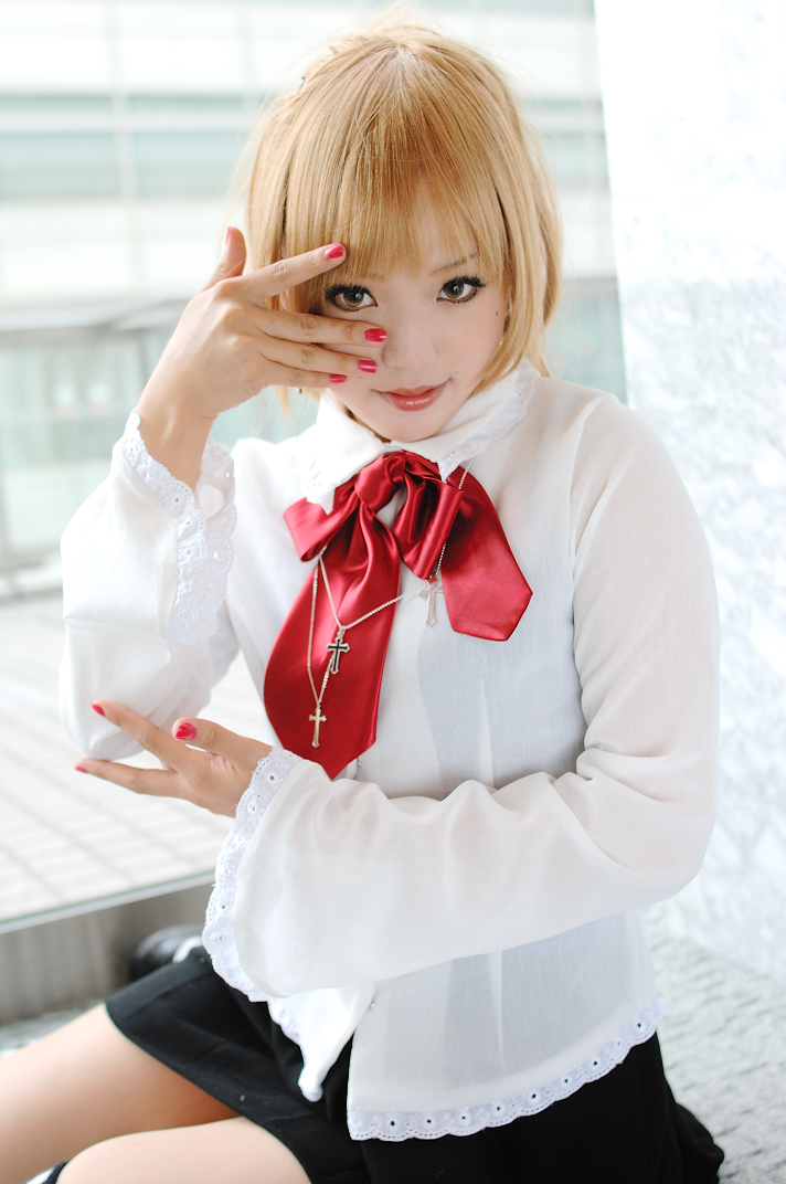 kipi-san, amane misa, death note, photo (medium), 1girl, amane misa (cosplay), asian, blonde hair, blouse, breasts, cosplay, cross, cross necklace, female focus, indoors, jewelry, looking at viewer, miniskirt, mole, necklace, school uniform, shirt, sitting, skirt, small breasts, solo, striped clothes, striped thighhighs, thighhighs, yokozuwari