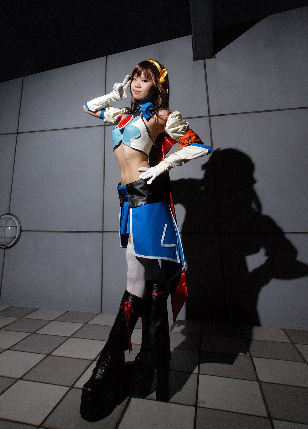 taku anko, suzumiya haruhi, suzumiya haruhi no tomadoi, suzumiya haruhi no yuuutsu, highres, photo (medium), boots, cape, cosplay, elbow gloves, gloves, hair ribbon, halterneck, midriff, pleated skirt, ribbon, skirt, thighhighs