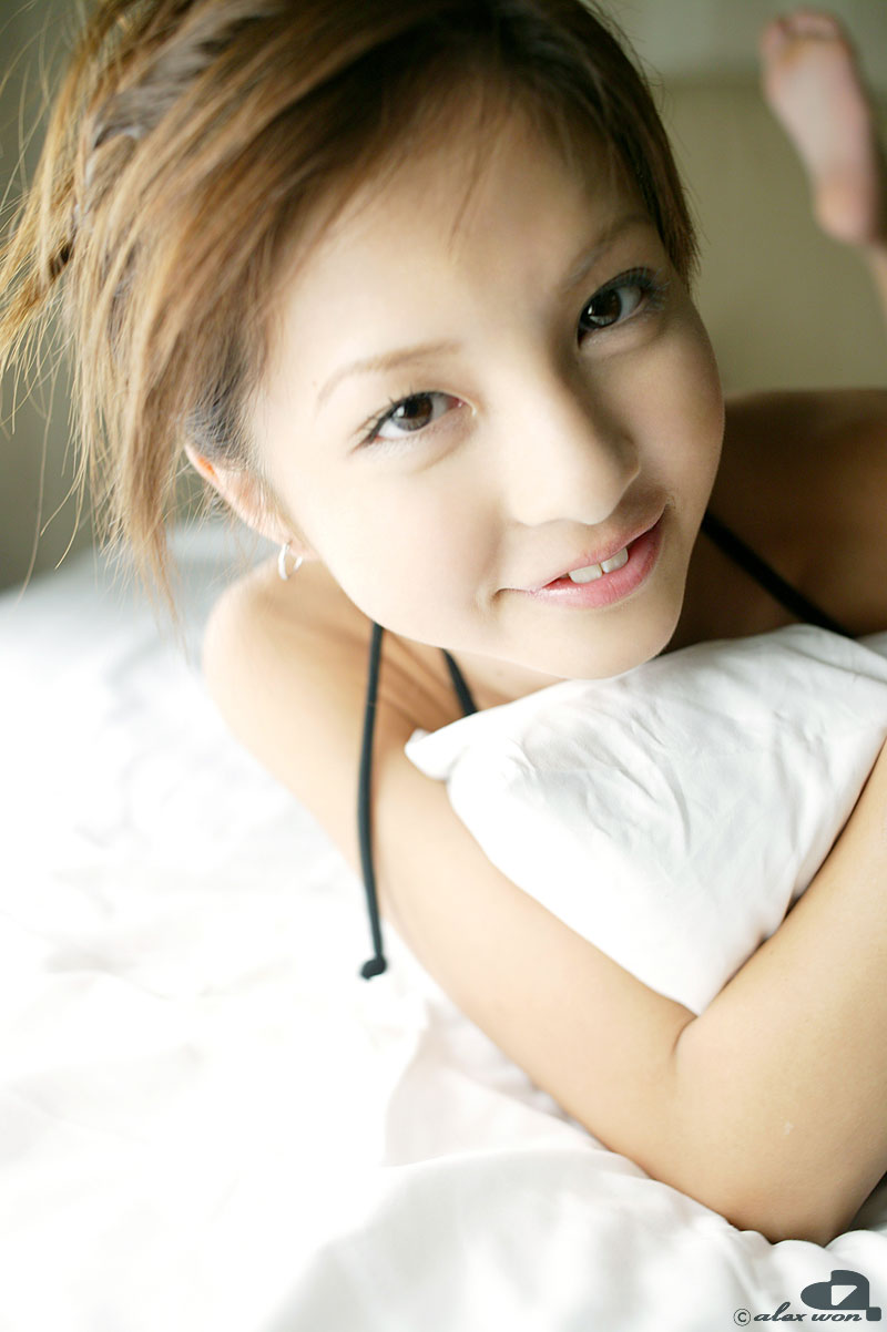 nagasaki rina, highres, photo (medium), 1girl, asian, bed, bikini, bikini top only, brown eyes, brown hair, earrings, female focus, grin, indoors, jewelry, looking at viewer, smile, solo, swimsuit, teeth