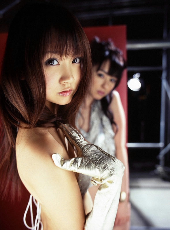 akiyama rina, hamada shoko, photo (medium), 2girls, asian, bikini, blurry, breasts, brown hair, depth of field, gloves, indoors, long hair, looking at viewer, multiple girls, small breasts, swimsuit