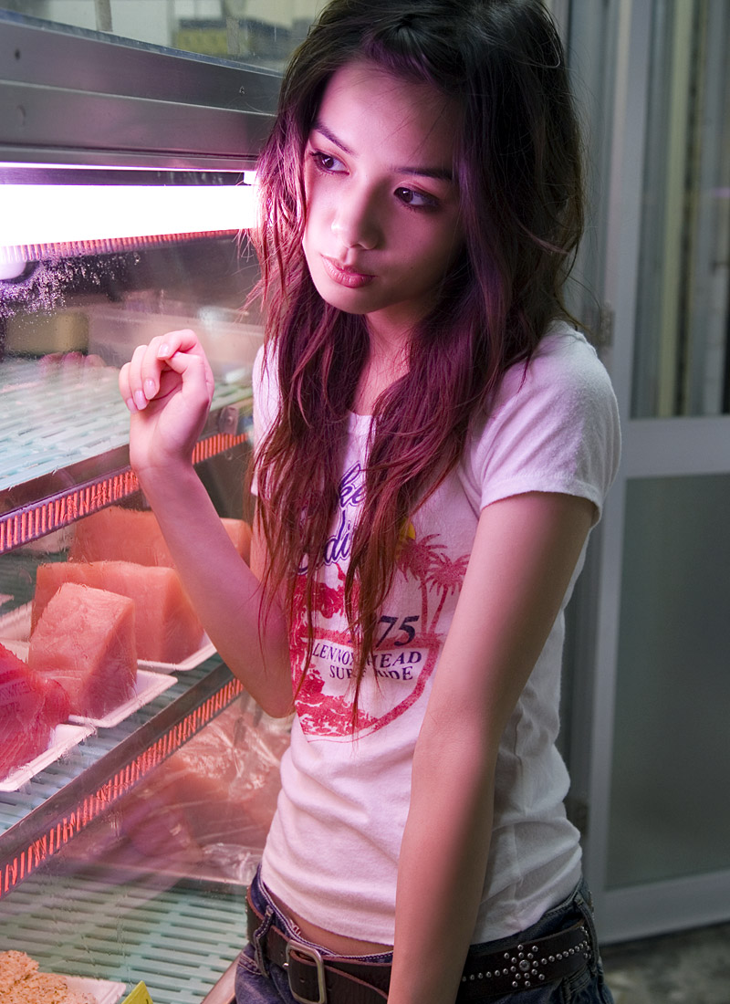 rola chung, photo (medium), tagme, 1girl, asian, belt, breasts, denim, female focus, food, indoors, long hair, meat, refrigerator, shirt, shorts, small breasts, solo, t-shirt