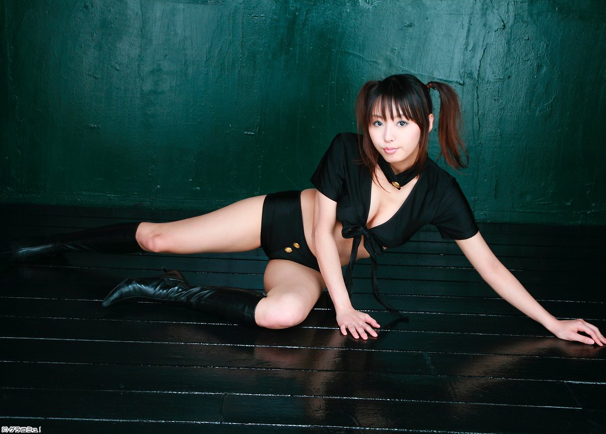 ahane ahaneco, boyshorts, photo (medium), 1girl, arm support, asian, black boots, black shirt, black shorts, boots, breasts, brown hair, choker, cleavage, female focus, front-tie top, halfshirt, indoors, looking at viewer, medium breasts, midriff, on floor, shirt, short shorts, shorts, solo, twintails, wooden floor