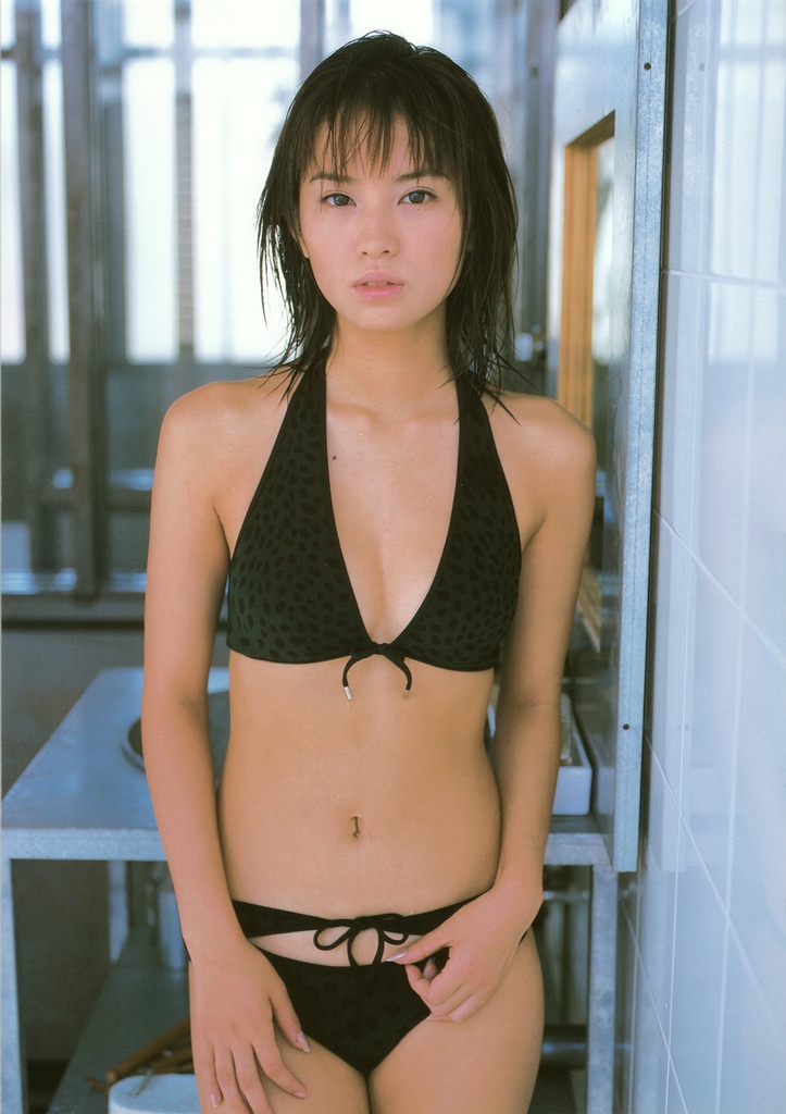 ichikawa yui, photo (medium), 1girl, animal print, asian, bikini, black bikini, brown hair, female focus, front-tie bikini top, front-tie top, indoors, leopard print, looking at viewer, mole, solo, swimsuit, tile wall, tiles