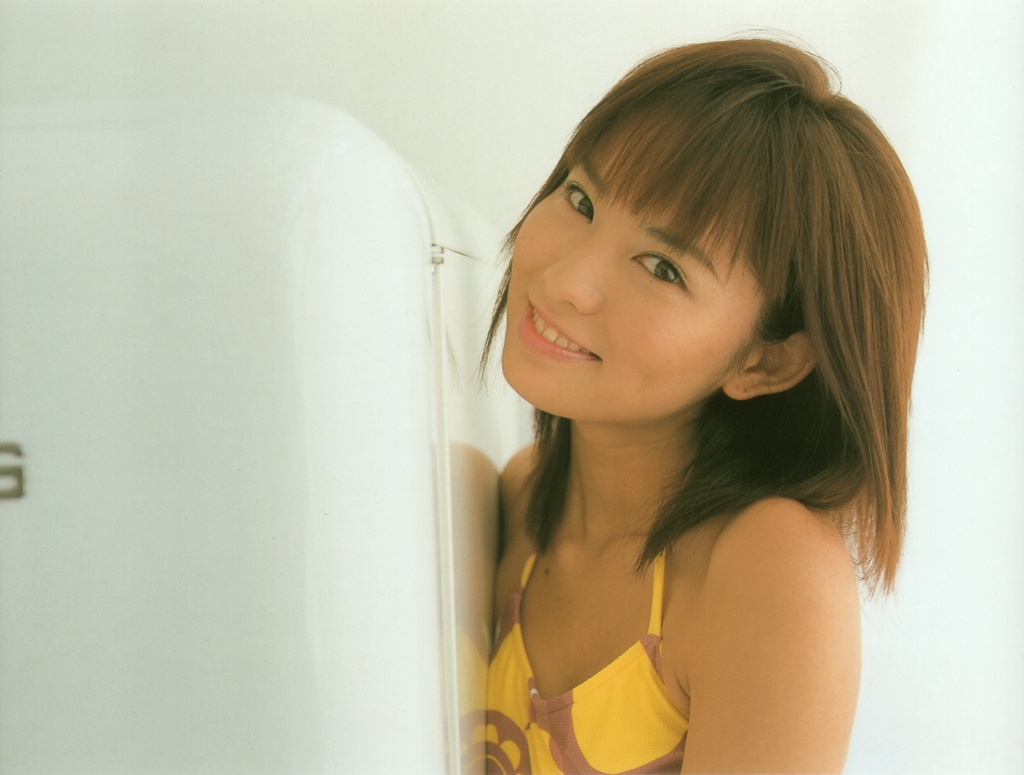 ichikawa yui, photo (medium), tagme, 1girl, asian, brown hair, female focus, halterneck, indoors, looking at viewer, mole, refrigerator, smile, solo