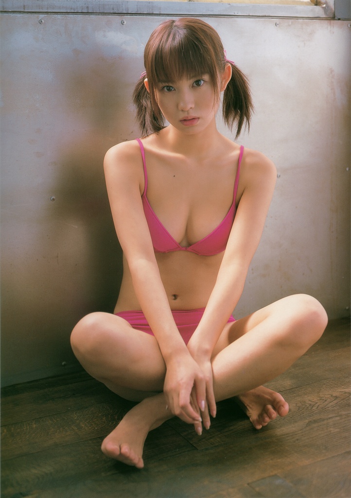 ichikawa yui, photo (medium), 1girl, asian, barefoot, bikini, brown hair, female focus, indian style, indoors, looking at viewer, mole, on floor, pink bikini, sitting, solo, swimsuit, twintails, wooden floor
