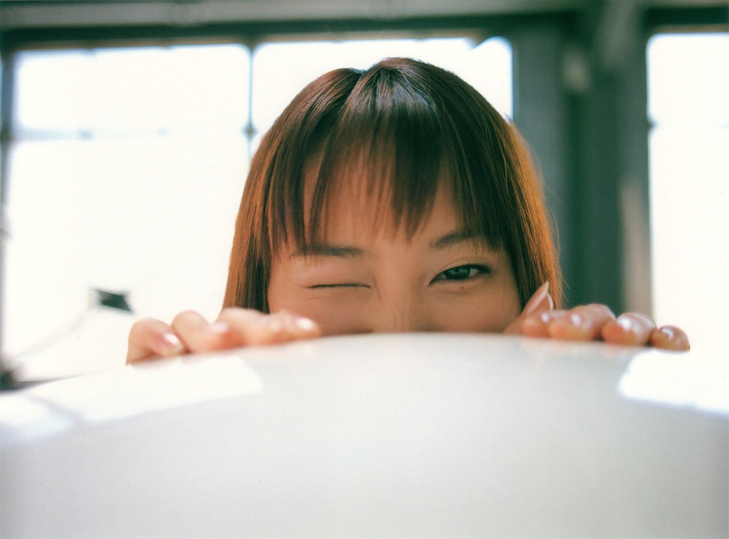 ichikawa yui, photo (medium), tagme, 1girl, asian, brown hair, female focus, indoors, looking at viewer, one eye closed, solo, wink
