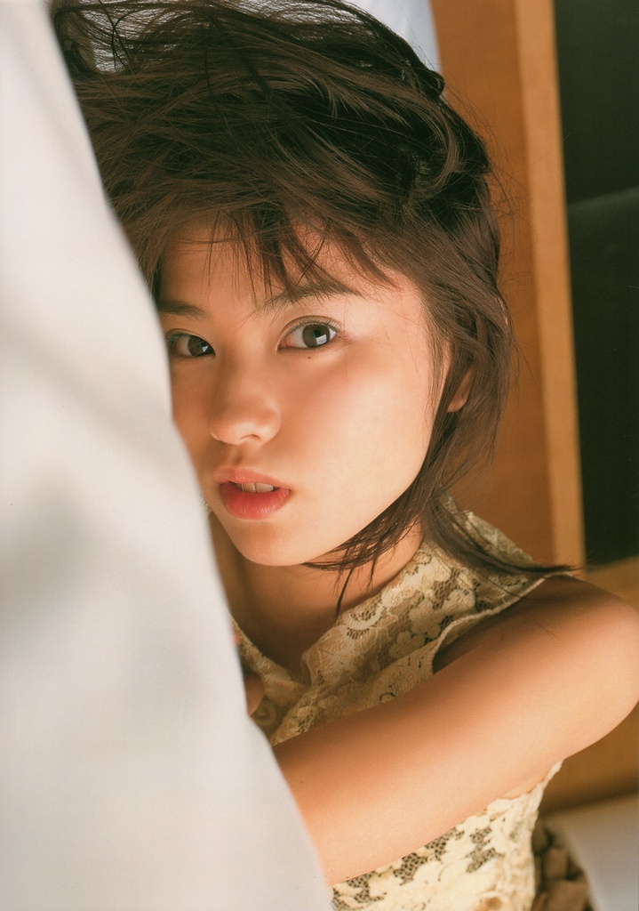 ichikawa yui, photo (medium), tagme, 1girl, asian, bed, brown hair, dutch angle, female focus, indoors, looking at viewer, mole, solo, tank top