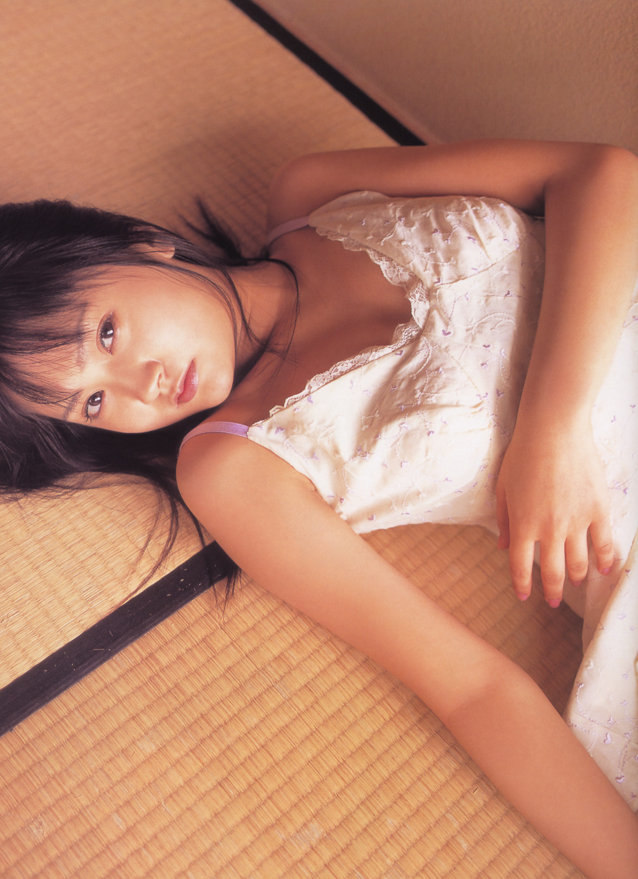 hamada shoko, lolita race queen, highres, photo (medium), tagme, 1girl, asian, breasts, dress, female focus, indoors, long hair, looking at viewer, lying, on back, small breasts, solo, tatami