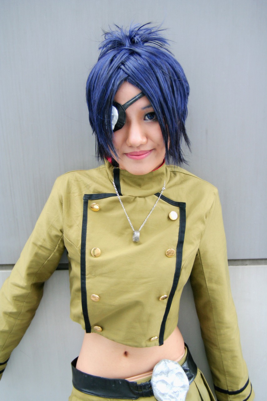 isumi (i-spixi), chrome dokuro, katekyo hitman reborn!, highres, photo (medium), 1girl, blue hair, cosplay, eyepatch, female focus, midriff, pleated skirt, skirt, solo