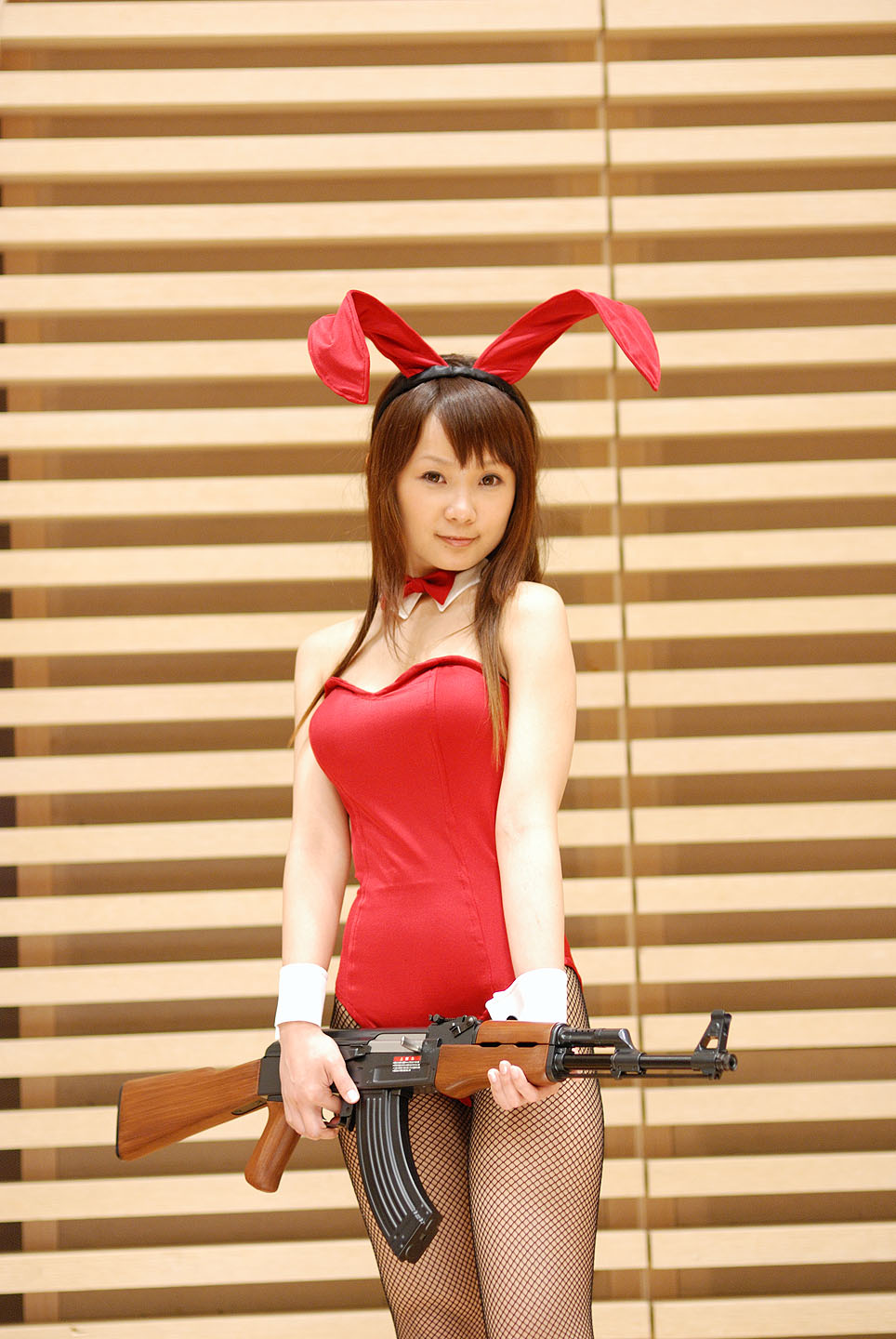 hiromichi, asahina mikuru, suzumiya haruhi no yuuutsu, fishnet legwear, highres, photo (medium), ak-47, animal ears, assault rifle, collar, cosplay, fishnets, gun, kalashnikov, kalashnikov rifle, leotard, rabbit ears, rifle, weapon
