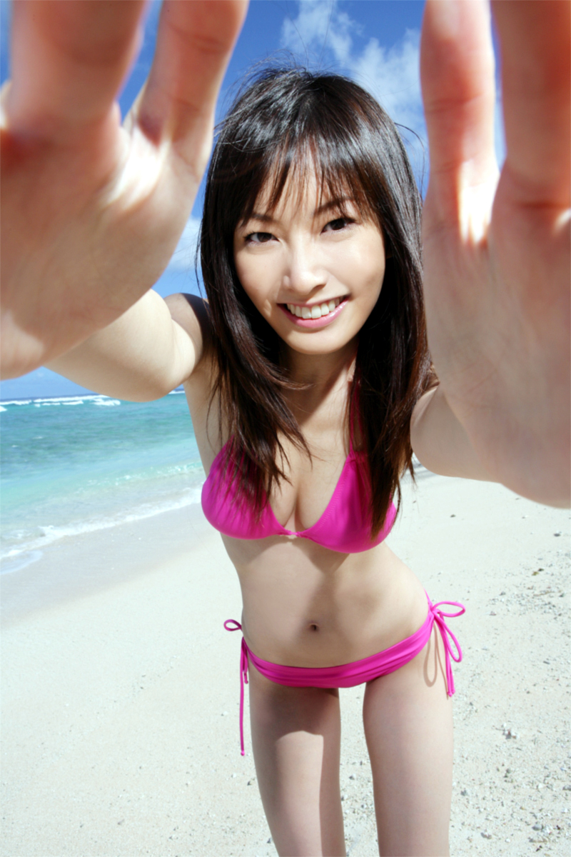 nagasawa nao, highres, photo (medium), 1girl, asian, beach, bikini, looking at viewer, ocean, outdoors, side-tie bikini bottom, swimsuit