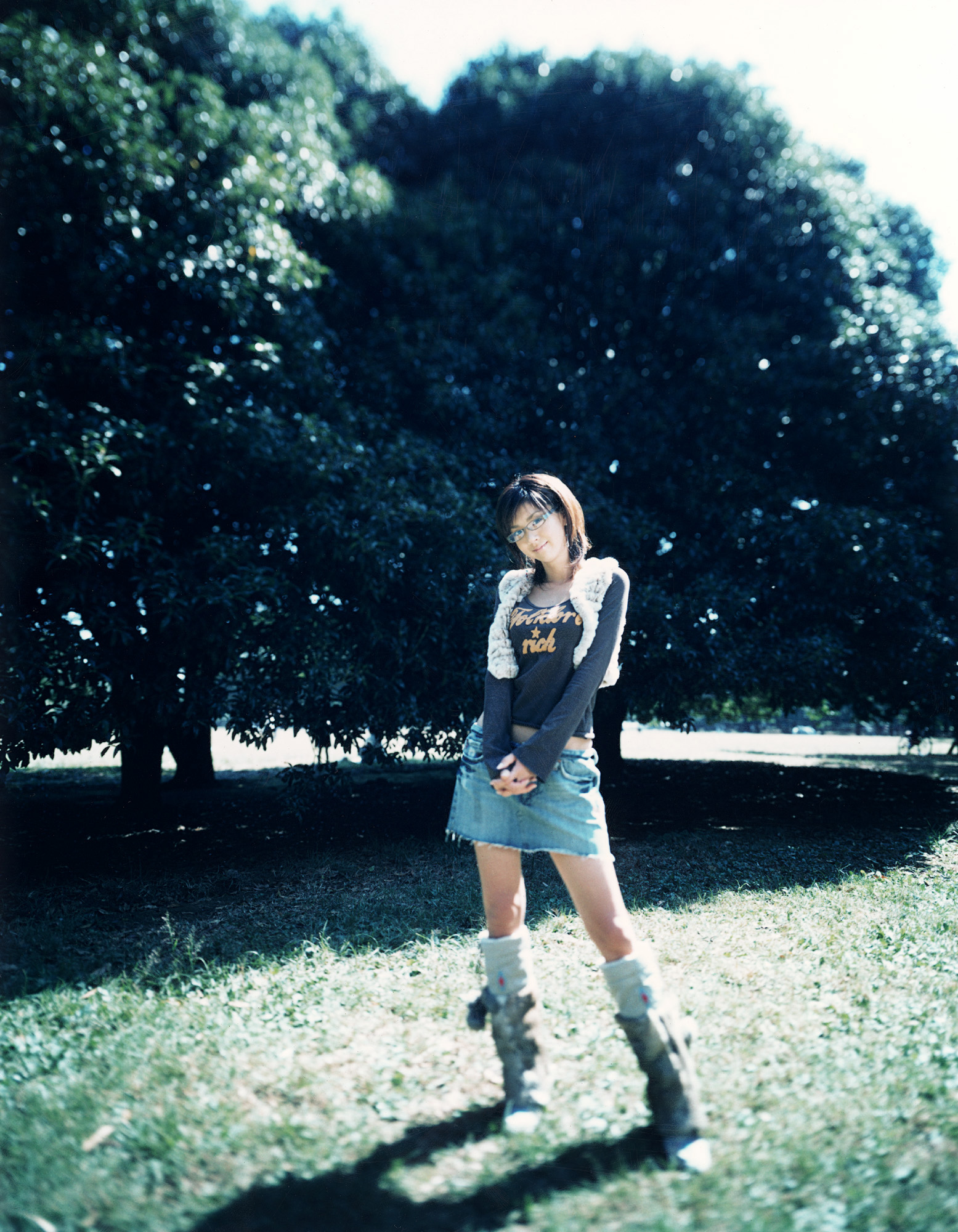 hoshino aki, highres, photo (medium), boots, denim, glasses, long sleeves, miniskirt, shirt, skirt, t-shirt, vest