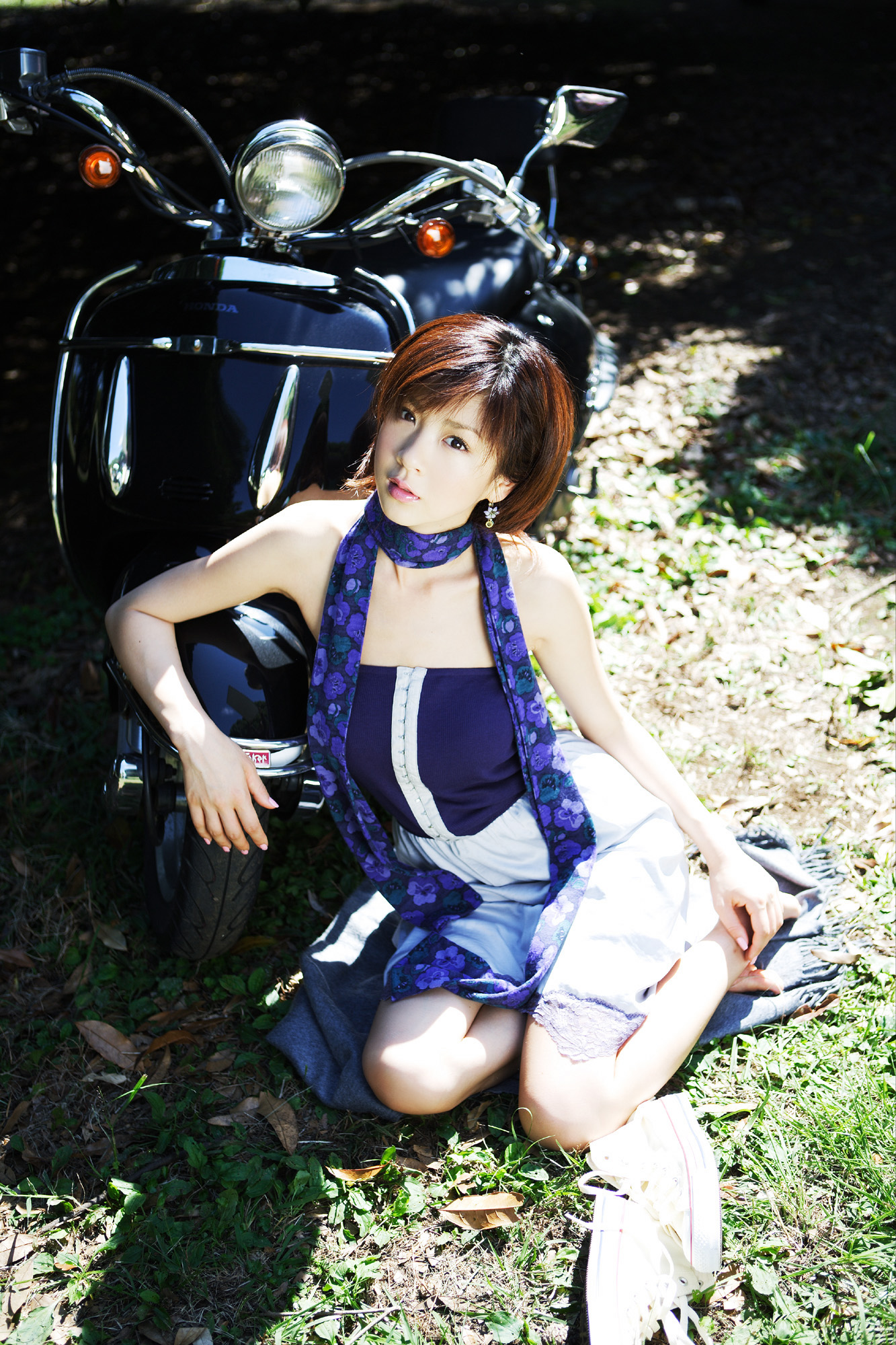 hoshino aki, vehicle, highres, photo (medium), 1girl, asian, dress, female focus, japanese (nationality), motor vehicle, outdoors, scarf, scooter, sitting, socks, solo, strapless, strapless dress, yokozuwari