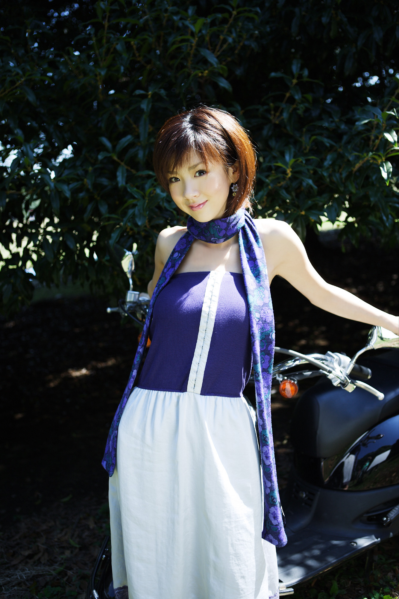 hoshino aki, vehicle, highres, photo (medium), 1girl, asian, dress, female focus, japanese (nationality), motor vehicle, outdoors, scarf, scooter, solo, strapless, strapless dress