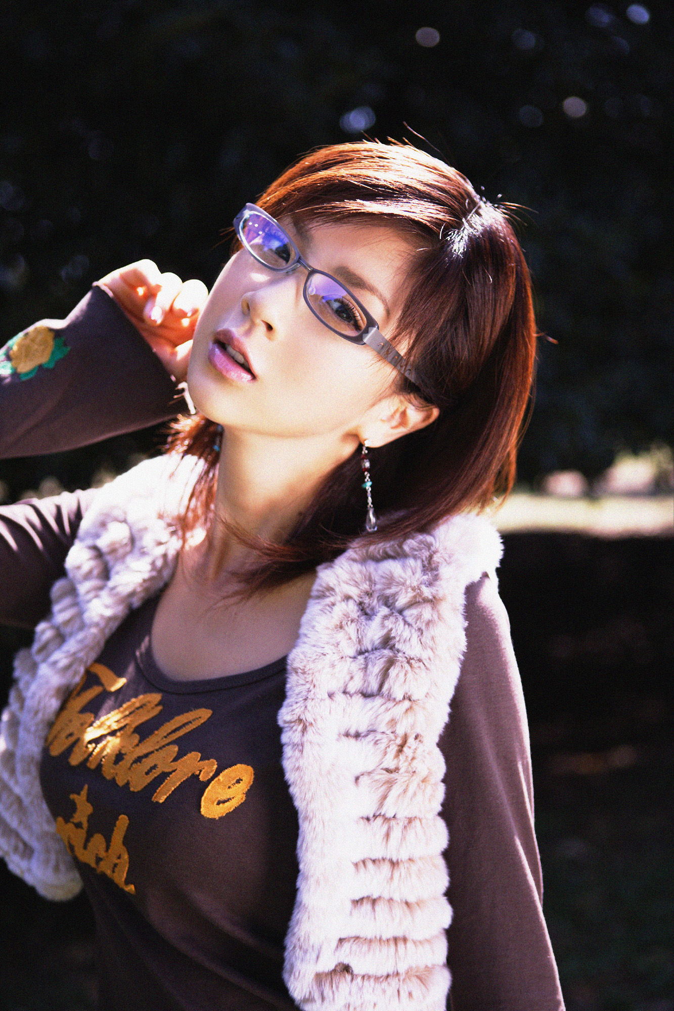 hoshino aki, highres, photo (medium), 1girl, breasts, brown hair, earrings, female focus, glasses, head tilt, jewelry, large breasts, long sleeves, looking at viewer, outdoors, shirt, solo, vest