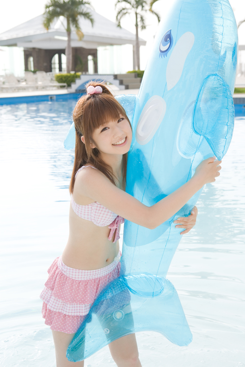 ogura yuuko, autumn breeze, highres, photo (medium), 1girl, bikini, bikini top only, inflatable dolphin, inflatable toy, miniskirt, polka dot, pool, skirt, smile, swimsuit