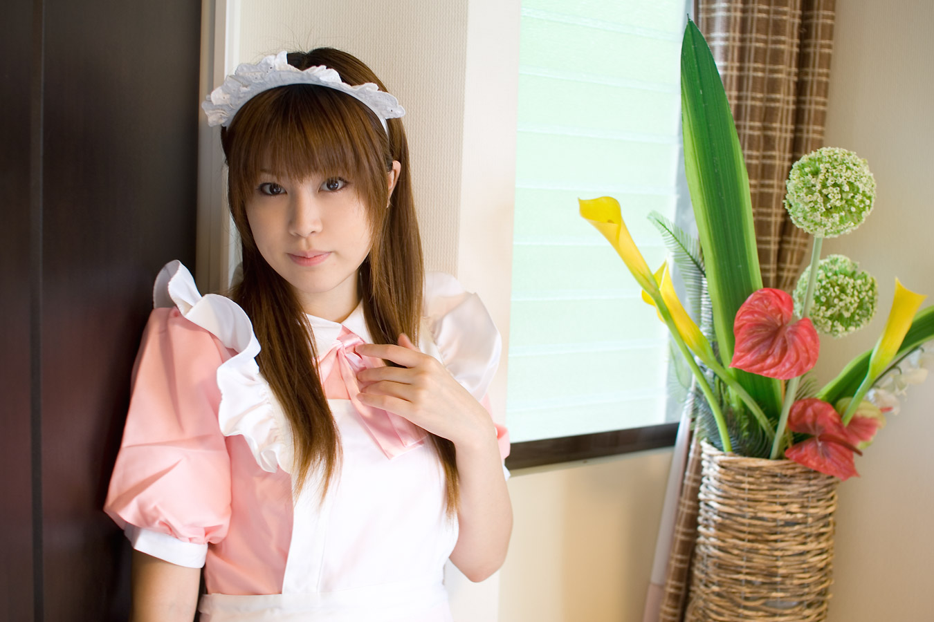 adachi mikki, photo (medium), 1girl, apron, asian, brown hair, cosplay, dyed hair, female focus, indoors, looking at viewer, maid, maid apron, solo