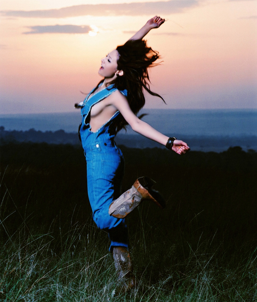 leah dizon, highres, photo (medium), africa, boots, breasts, denim, kenya, overalls, sideboob